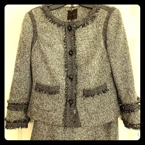 Women’s suit with blazer and skirt.